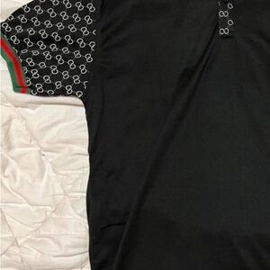 Elegant Black Polo Shirt with Patterned Sleeves